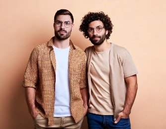 Firefly-two-male-web-designers-dressed-with-t-shirts-on-light-pastel-background-42686-334x260